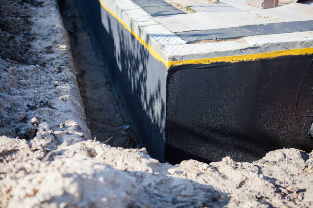 Professional Interior Drainage System technician working in Sawyerville, AL